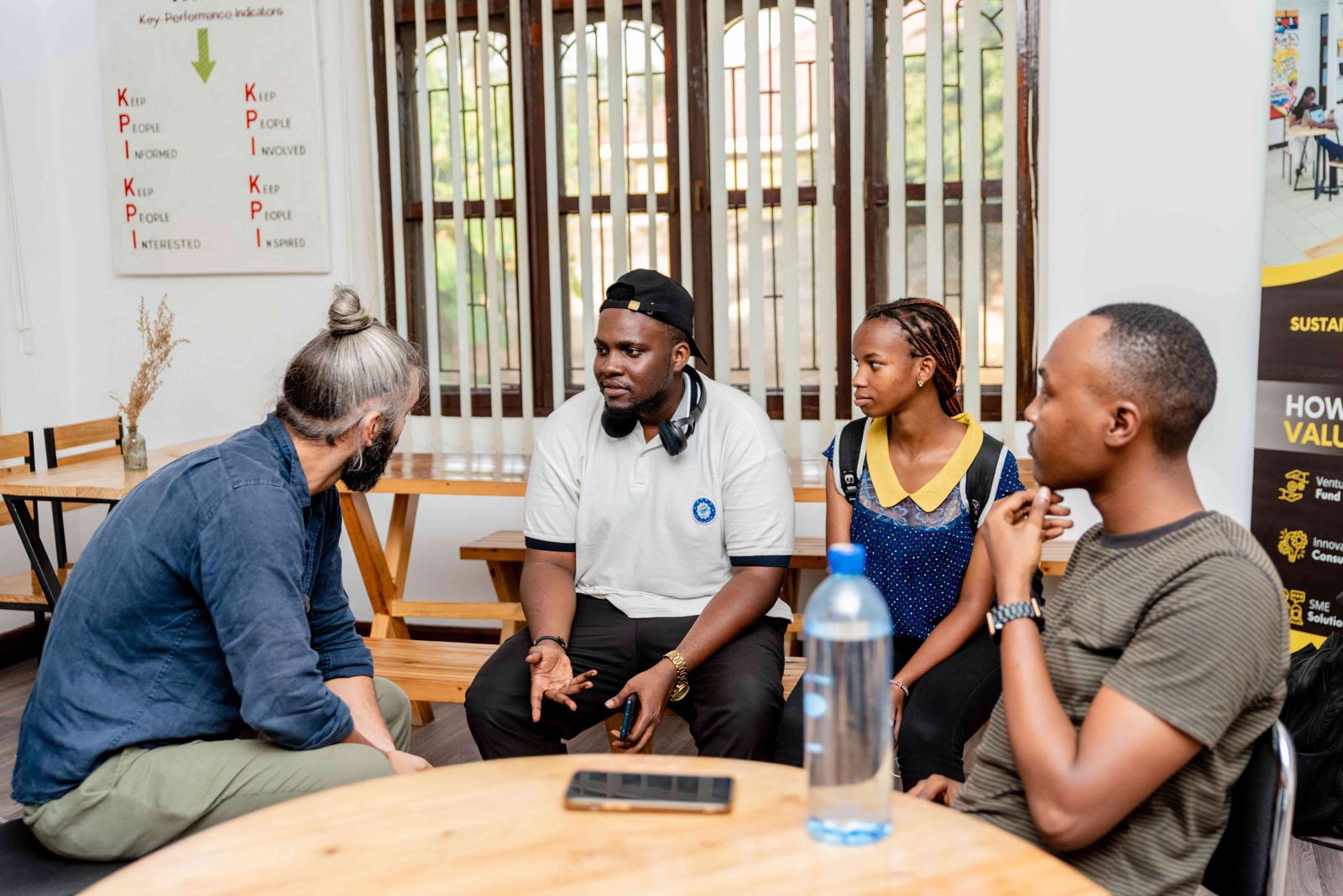 Entrepreneurs in a mentorship session with an investor